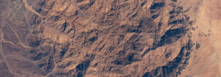 The dome-shaped Brandburg Massif, near the Atlantic coast of central Namibia, containing Brandberg Mountain, the African nation's highest peak and ancient rock paintings going back at least 2,000 years, is pictured from the International Space Station as it orbited 261 miles above.